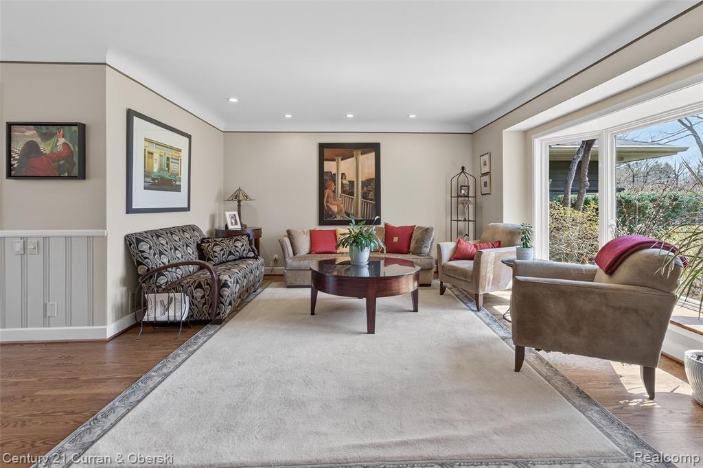 Living room with wood finished floors and recessed lighting