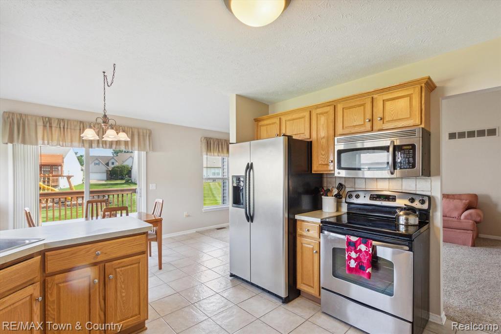 2571 ARALIA Drive, Howell, MI 48855 — Photo 14