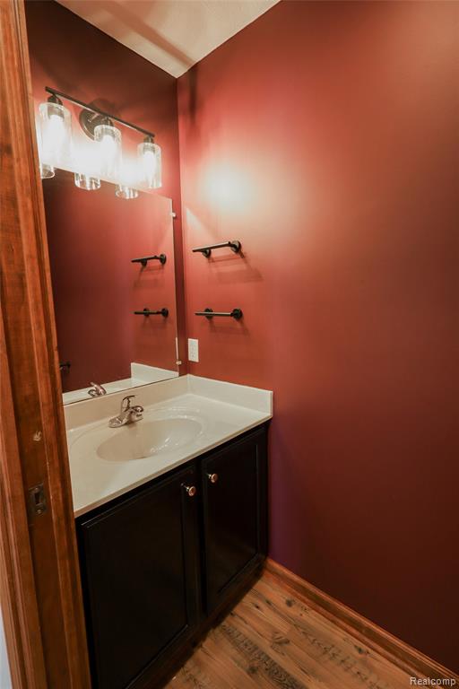 Bathroom with vanity and light wood-type flooring
