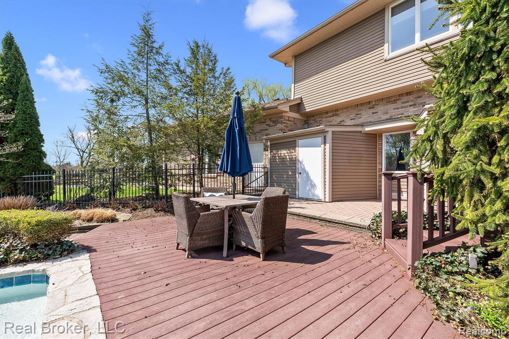 Wooden terrace featuring outdoor dining area