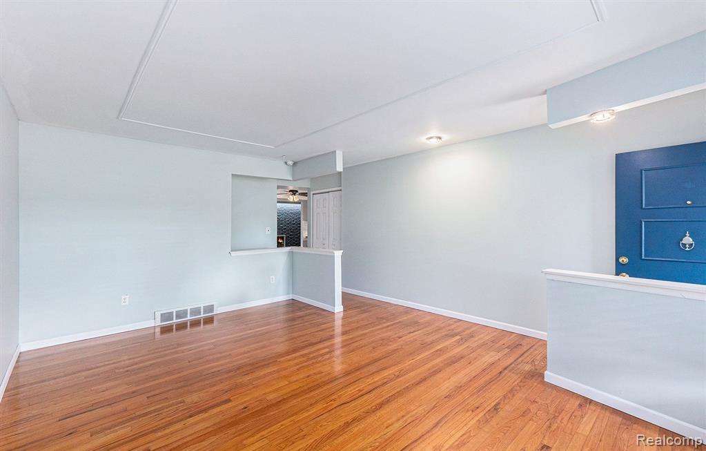 Spare room with light wood-type flooring and baseboards