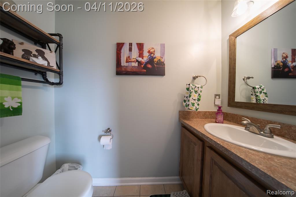 Bathroom with vanity and light tile patterned floors