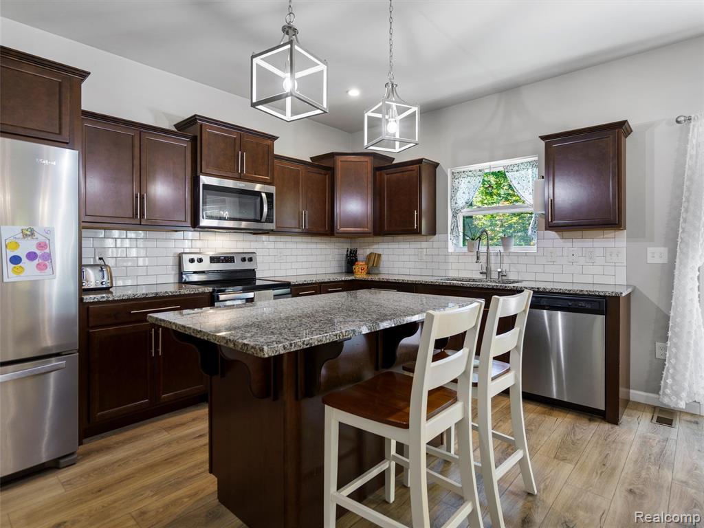5559 Radiant Avenue, Howell, MI 48855 — Photo 12