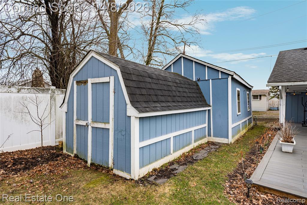 View of shed featuring a fenced backyard