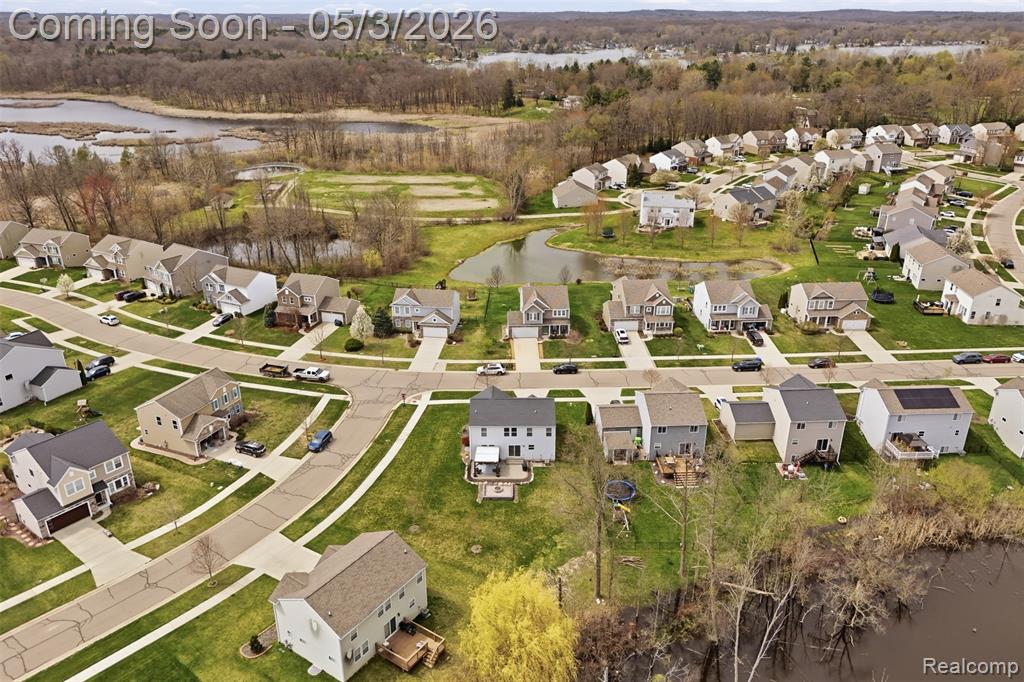 Aerial view of residential area with a large body of water