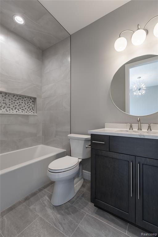 Bathroom featuring vanity and bathtub / shower combination