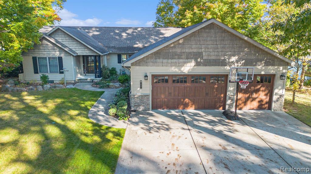 5001 GROVER Drive, Brighton, MI 48116 — front exterior