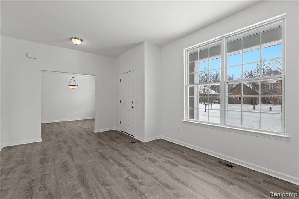 Bedroom featuring carpet floors and baseboards