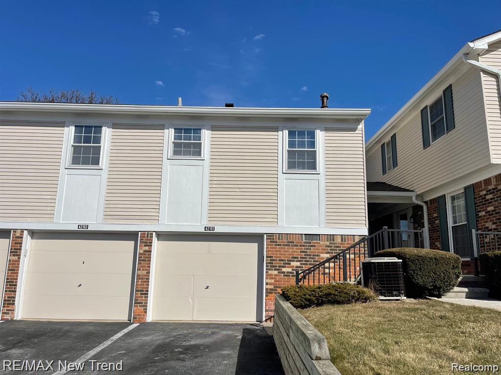 42101 ROSCOMMON Street, Northville, MI 48167 — front exterior