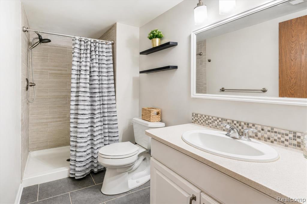 61025 Greenwood Drive, South Lyon, MI 48178 — Photo 21