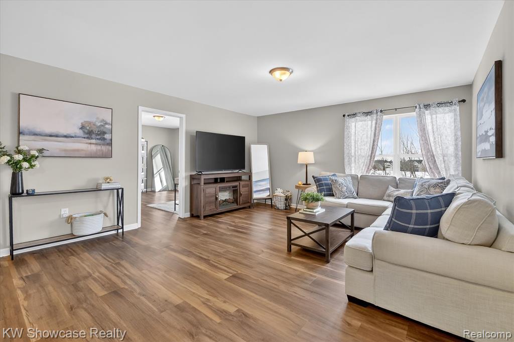 Living area featuring wood finished floors and baseboards