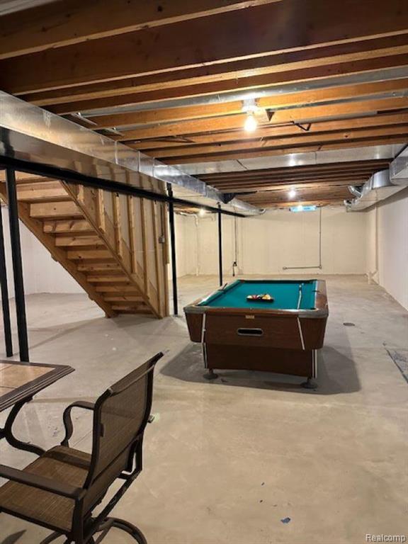 Carpeted spare room with baseboards and a ceiling fan