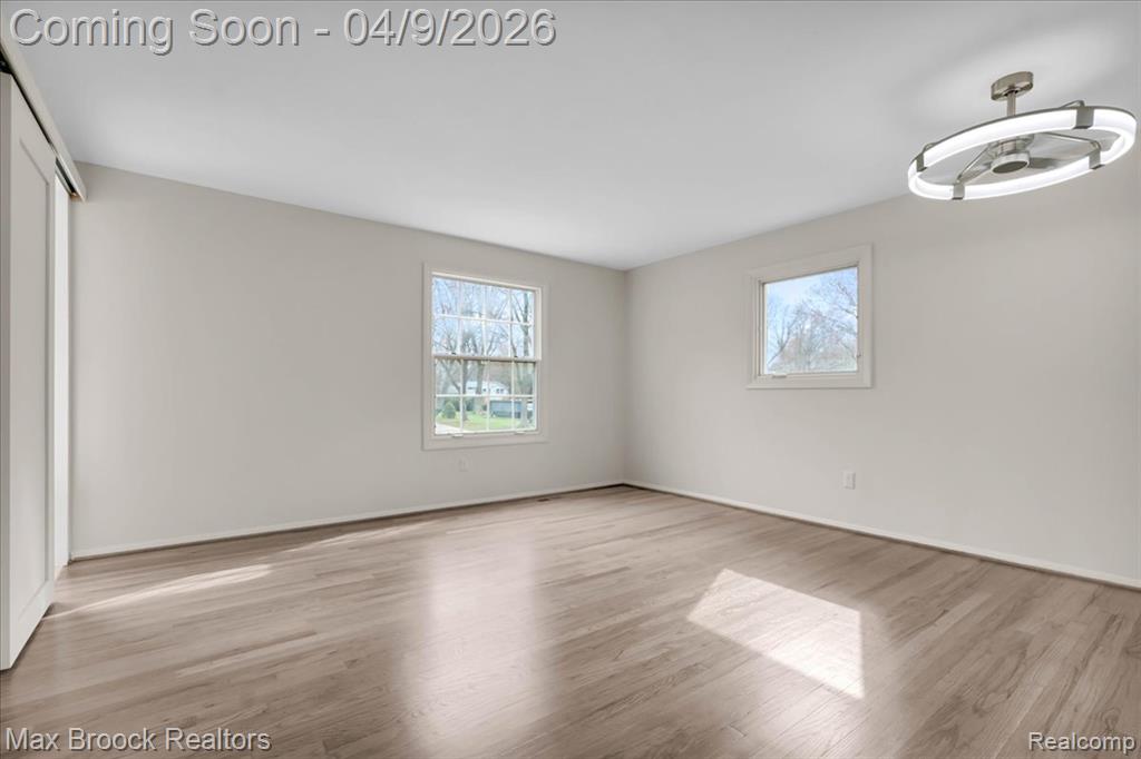 Unfurnished bedroom with a closet and light wood-style flooring