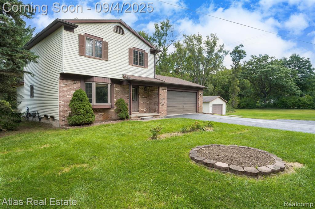 8557 Henderson Road, Goodrich Vlg, MI — front exterior