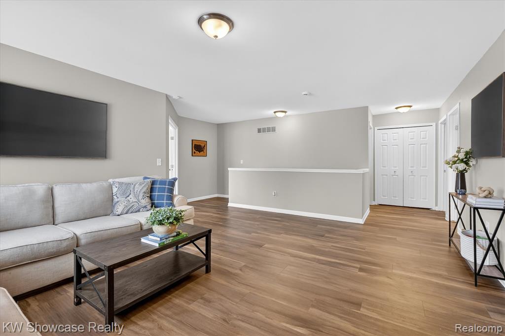Home office featuring wood finished floors and baseboards