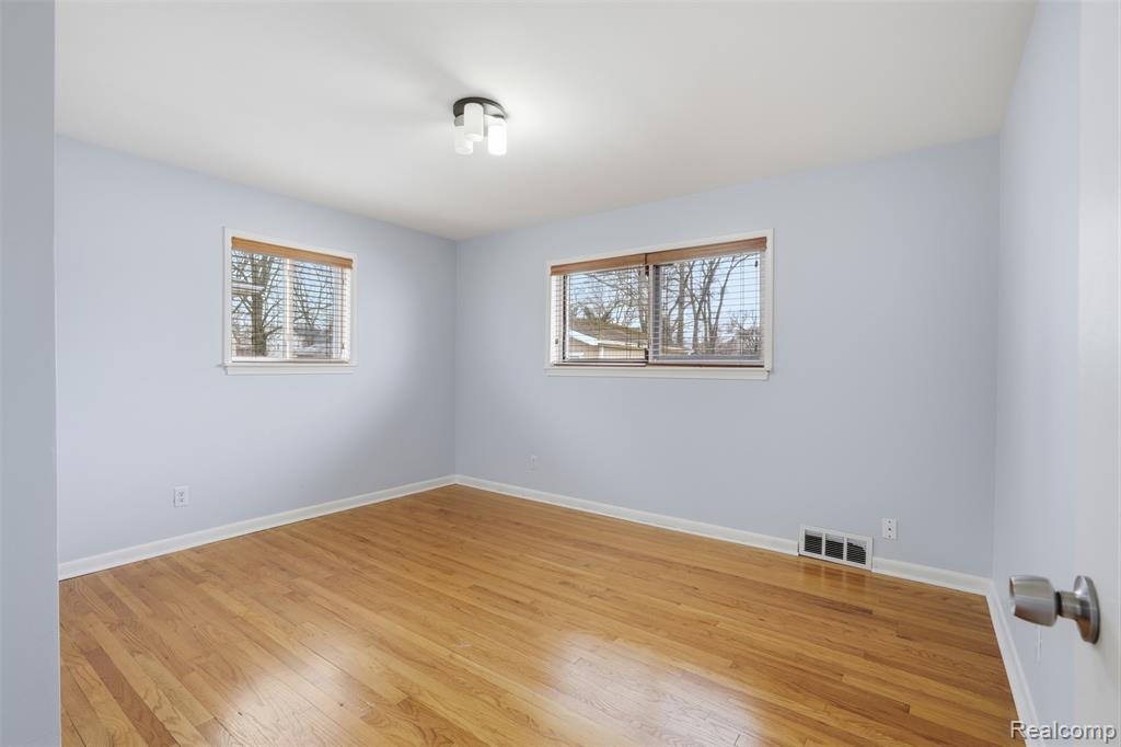 Spare room featuring light wood finished floors