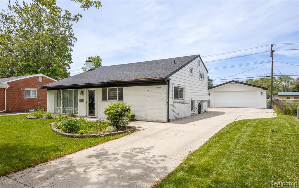 Photo for 36335 Weideman Street, Clinton Twp, MI 48035 - Listing #20251002596 Great curb appeal & an extra wide drive near garage