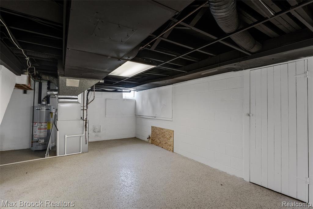 Basement with gas water heater and heating unit