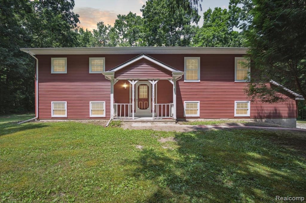 5849 Whispering Oaks Drive, Howell, MI 48855 — front exterior