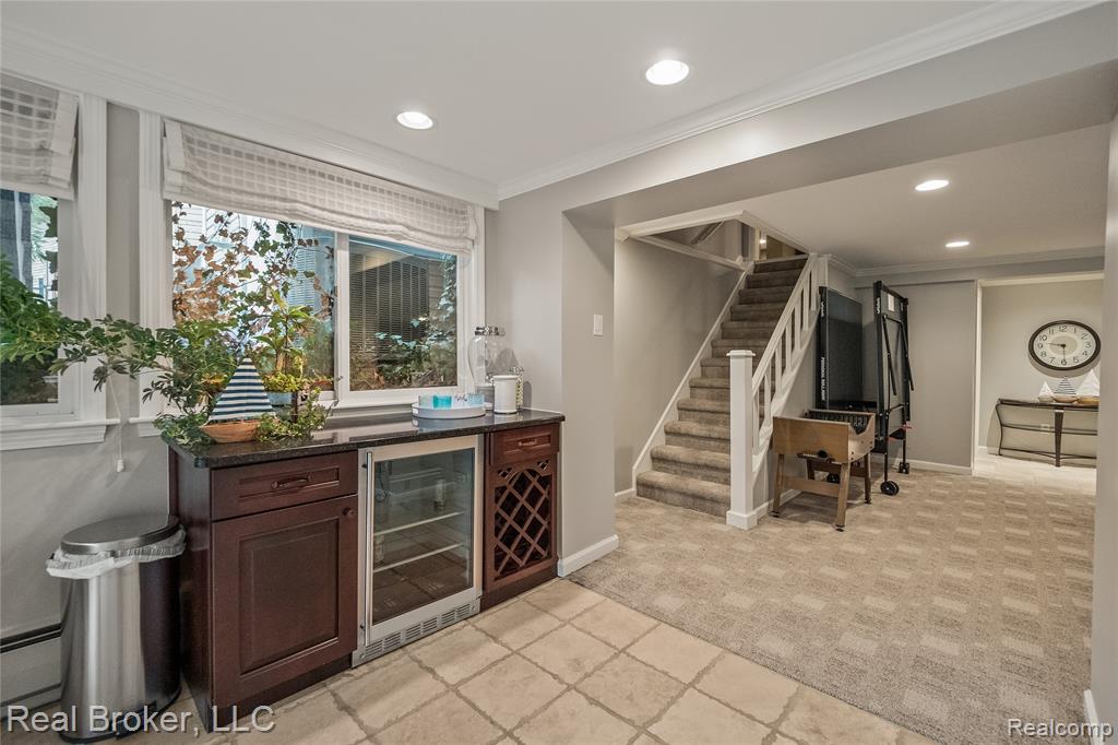 Half bath featuring light tile patterned flooring and toilet