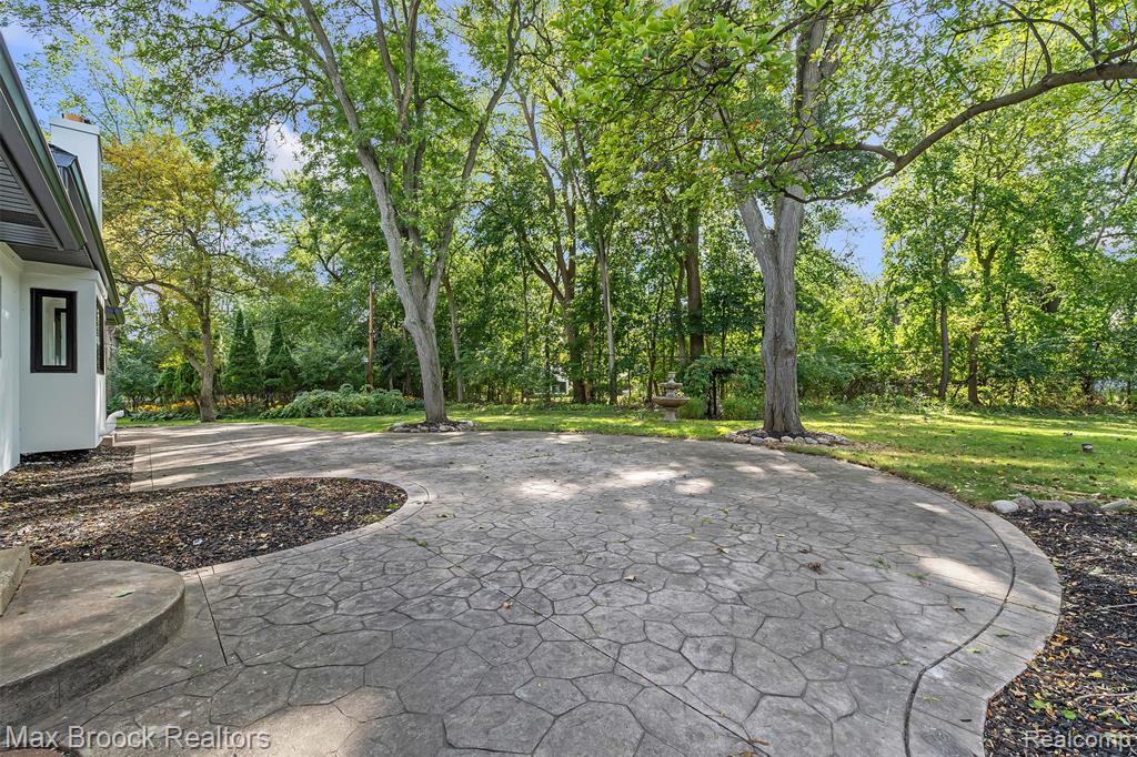 View of patio with view of wooded area