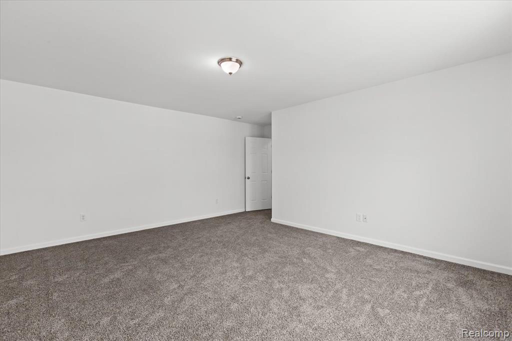 Traditional-style home with brick siding and covered porch