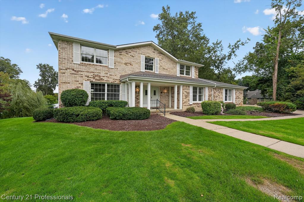 Brick exterior with white window shutters