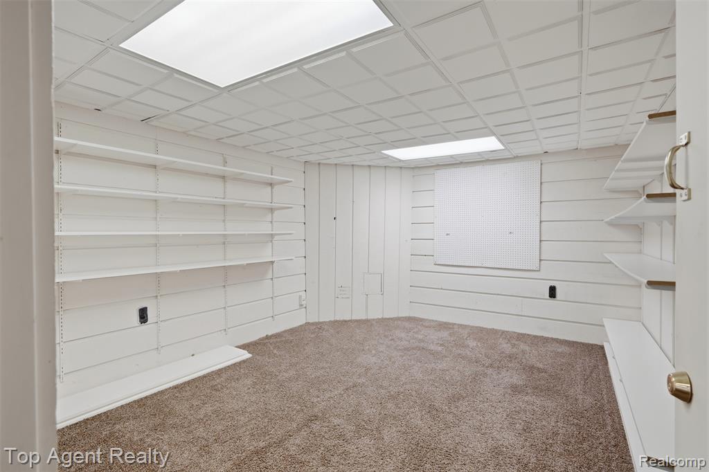 Bathroom with a stall shower, vanity, and light tile patterned floors