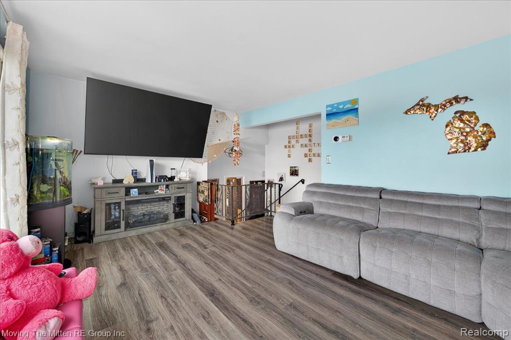 Living area with dark wood-style flooring
