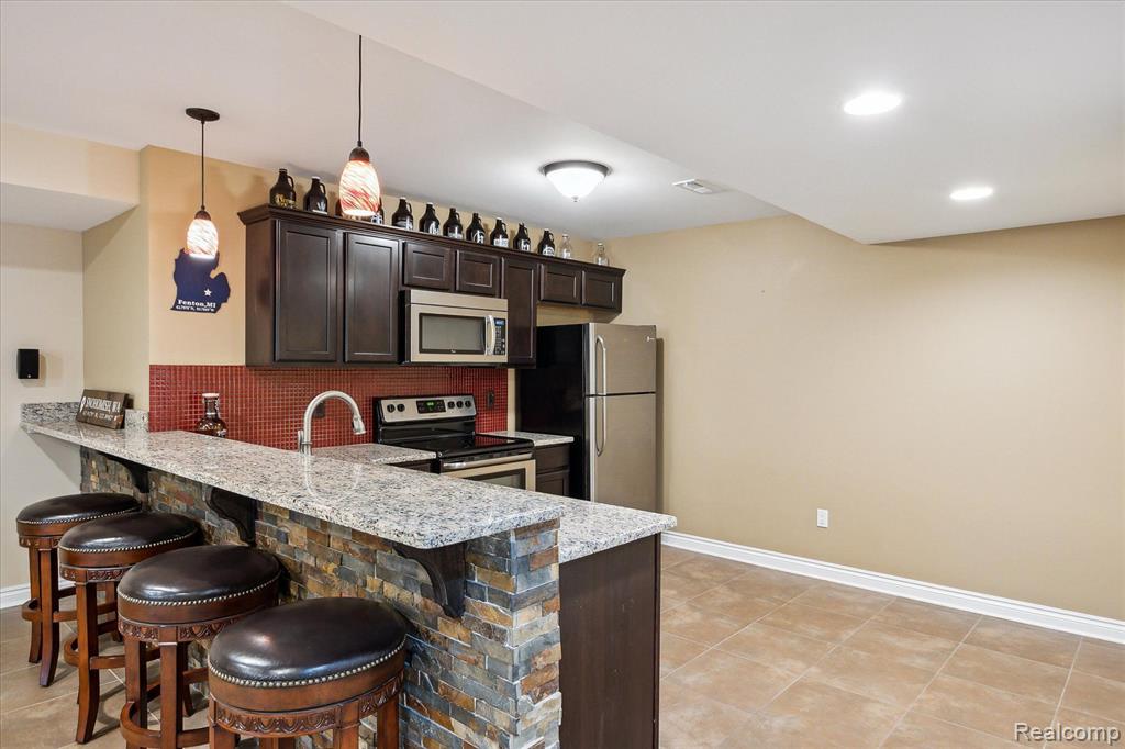 8504 Riverwalk Drive, Fenton, MI 48430 — Photo 48