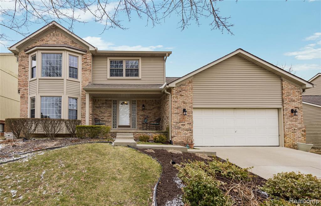 1874 Rothbury Drive, Wixom, MI 48393 — front exterior