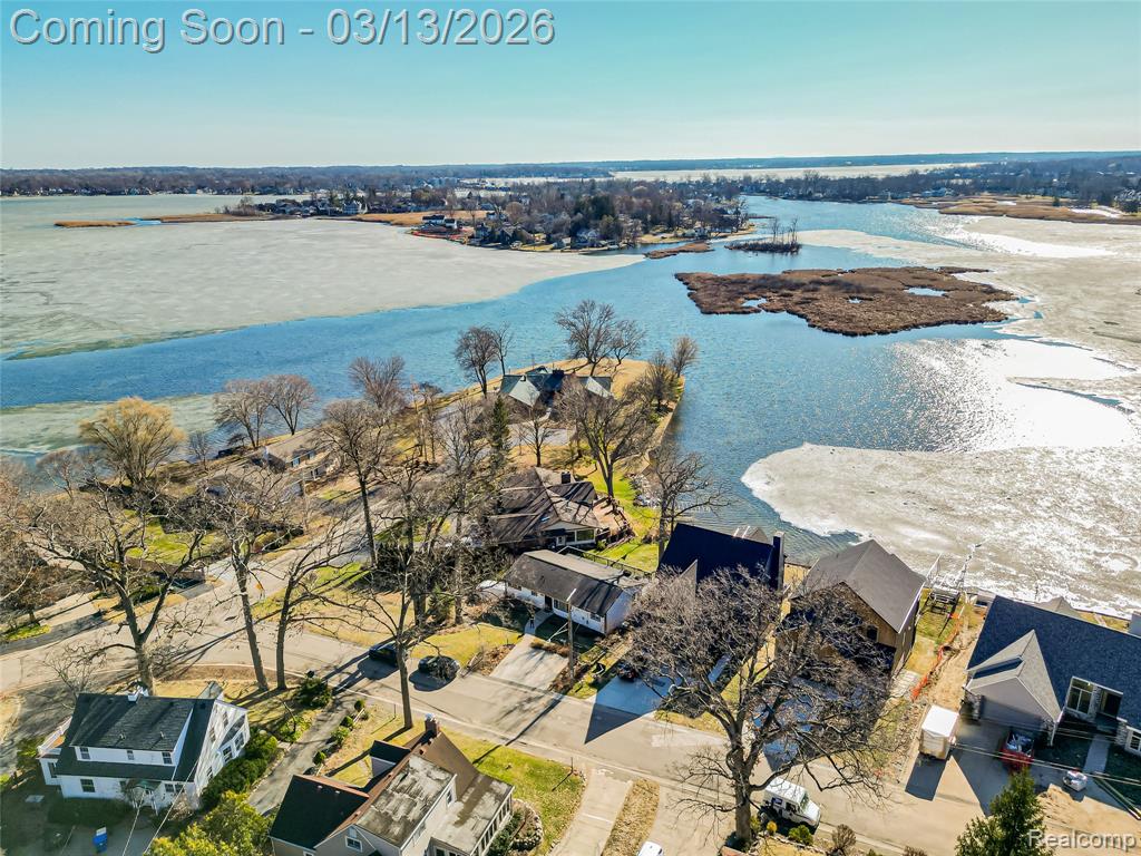 Back of property with a deck and a residential view