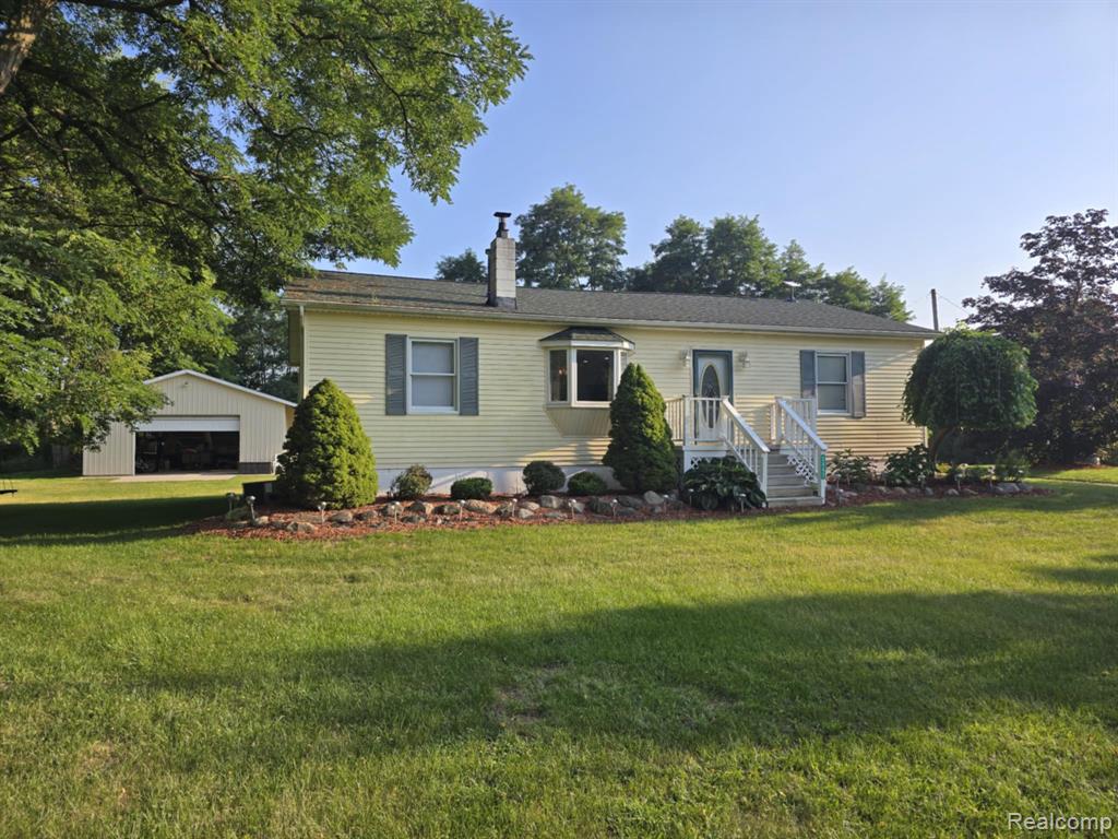 7647 Kitchen Road, Wales, MI — front exterior