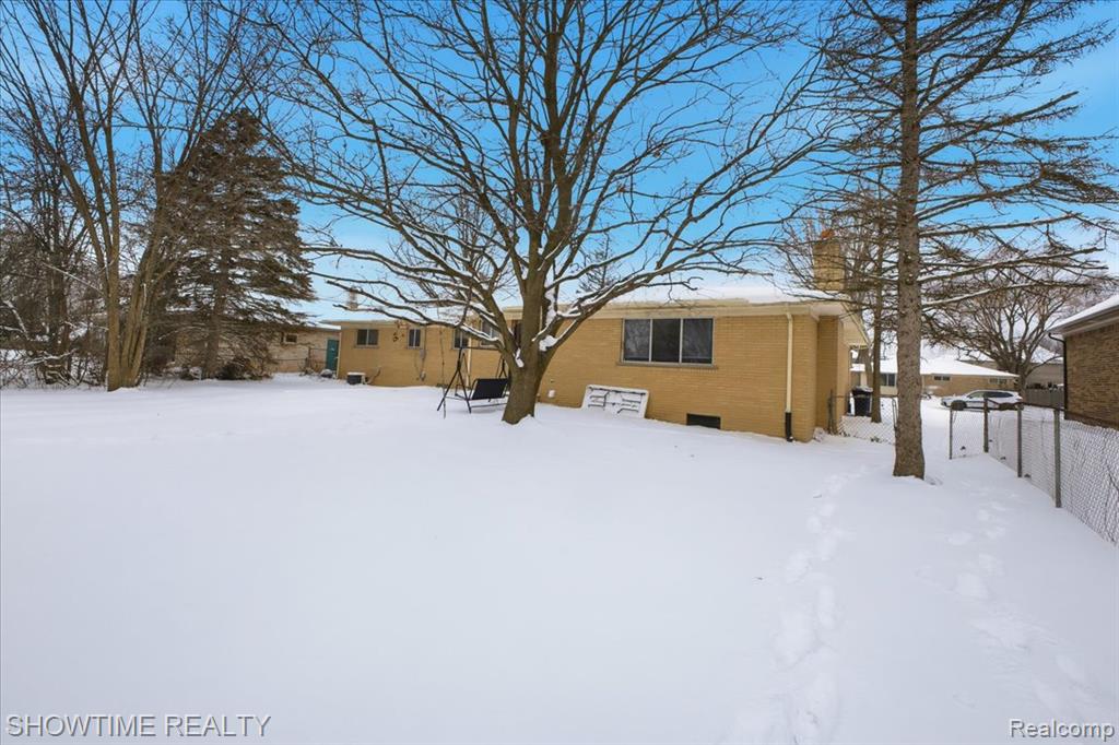 View of yard layered in snow