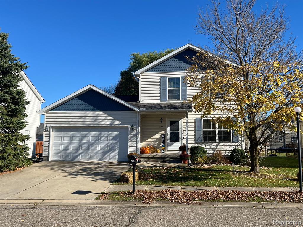 744 VILLAGE Drive, Fowlerville, MI 48836 — front exterior