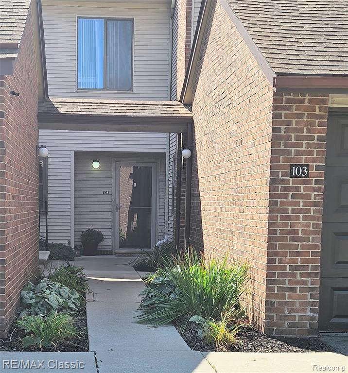 6740 Ridgefield Circle, 103, West Bloomfield, MI — front exterior