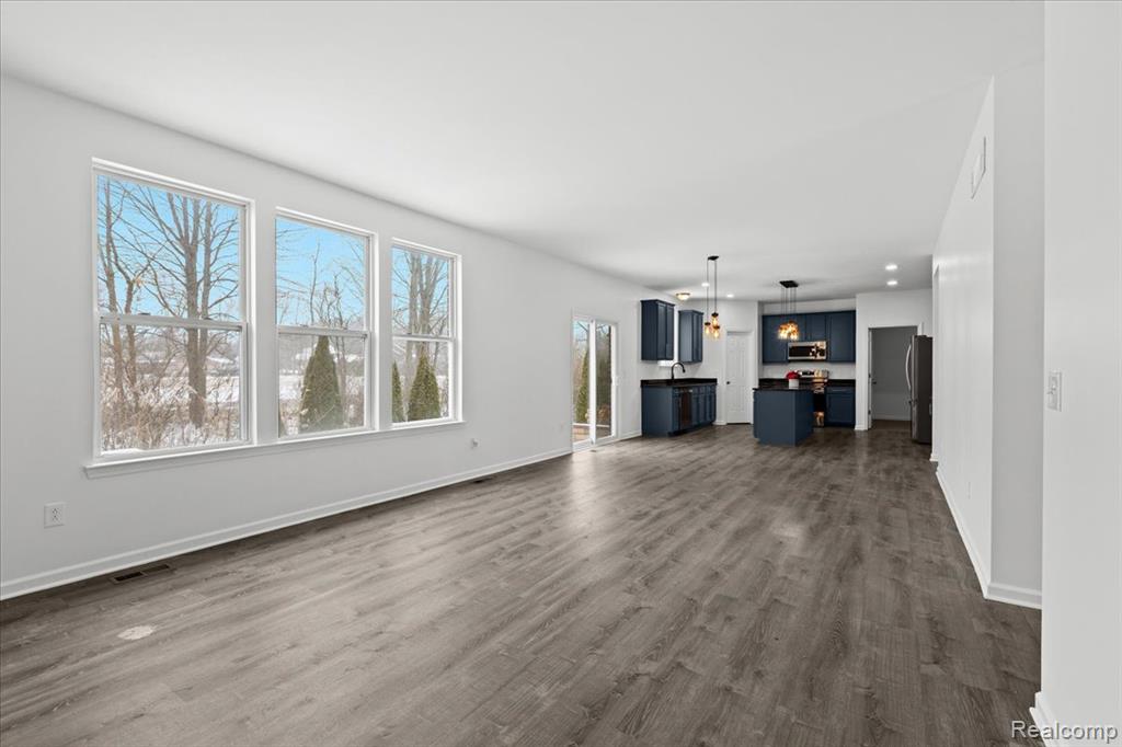 Carpeted bedroom featuring baseboards