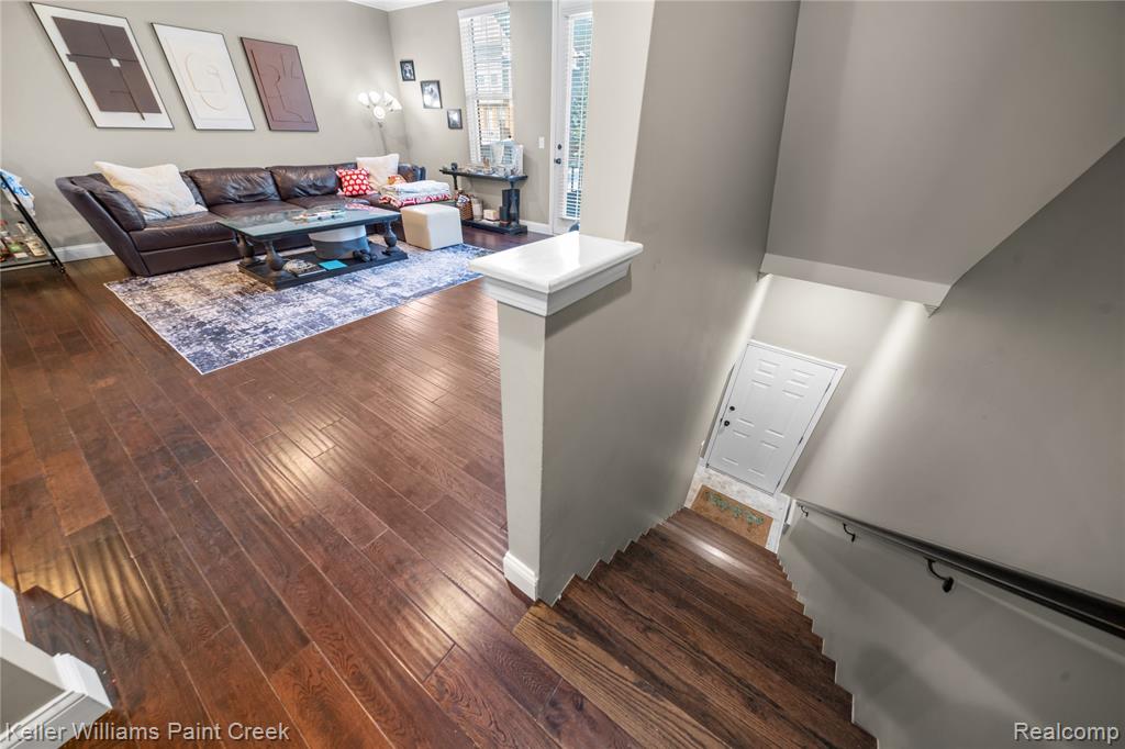 Living area with dark wood-style flooring
