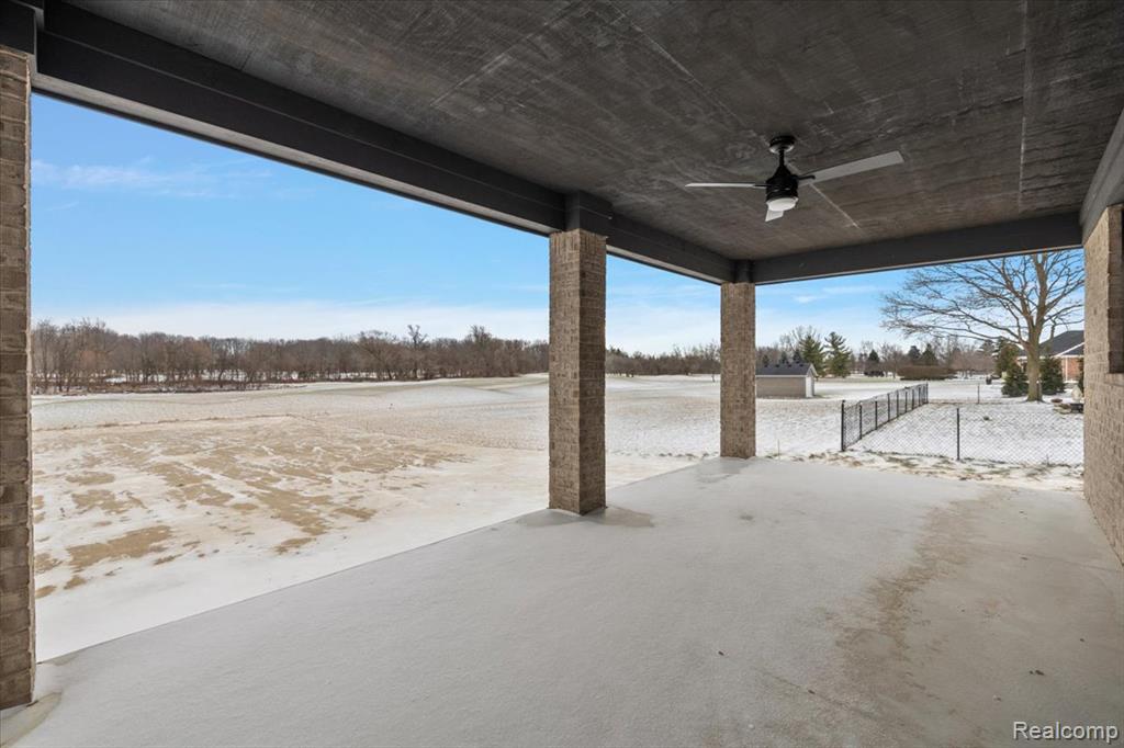 Large covered patio with ceiling fan