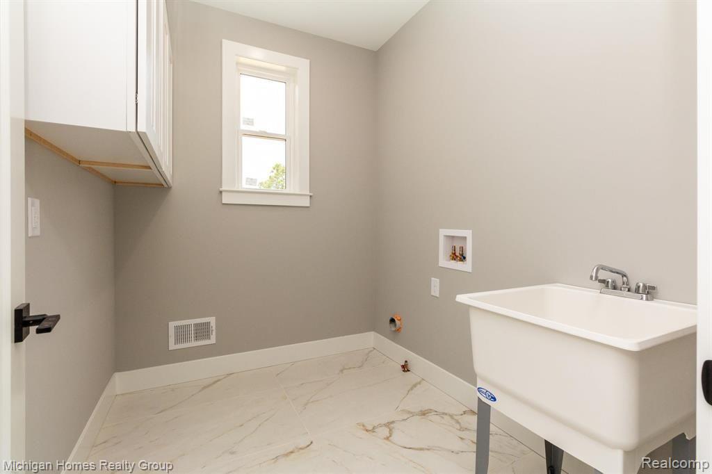 2910 LOON Drive, Wixom, MI 48393 — Photo 65