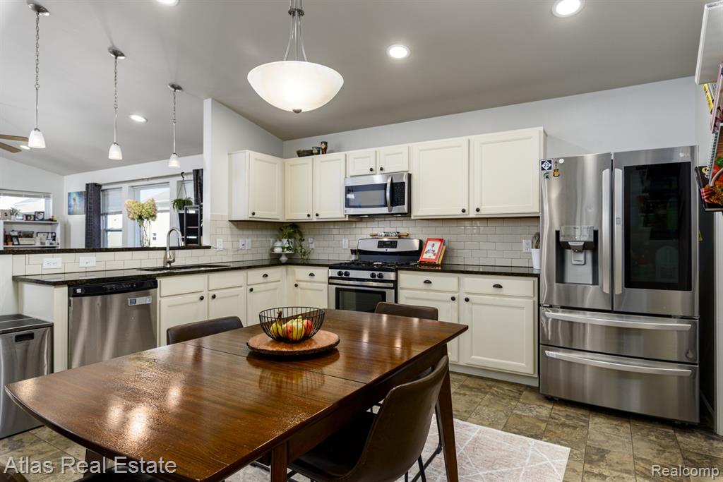 8582 Pinnebog River Drive, Fowlerville, MI 48836 — Photo 11