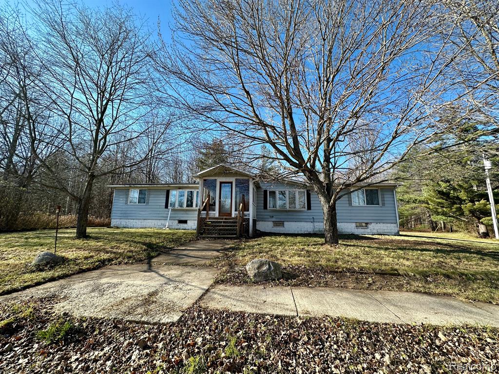 7700 RAVENSWOOD Road, Wales, MI — front exterior