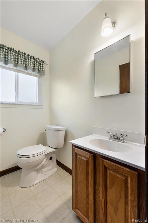 Bathroom featuring vanity and light floors