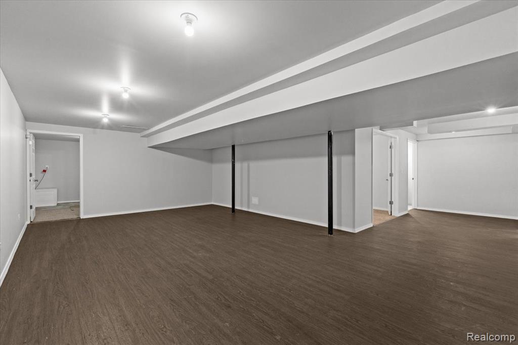 Traditional home featuring a garage and brick siding