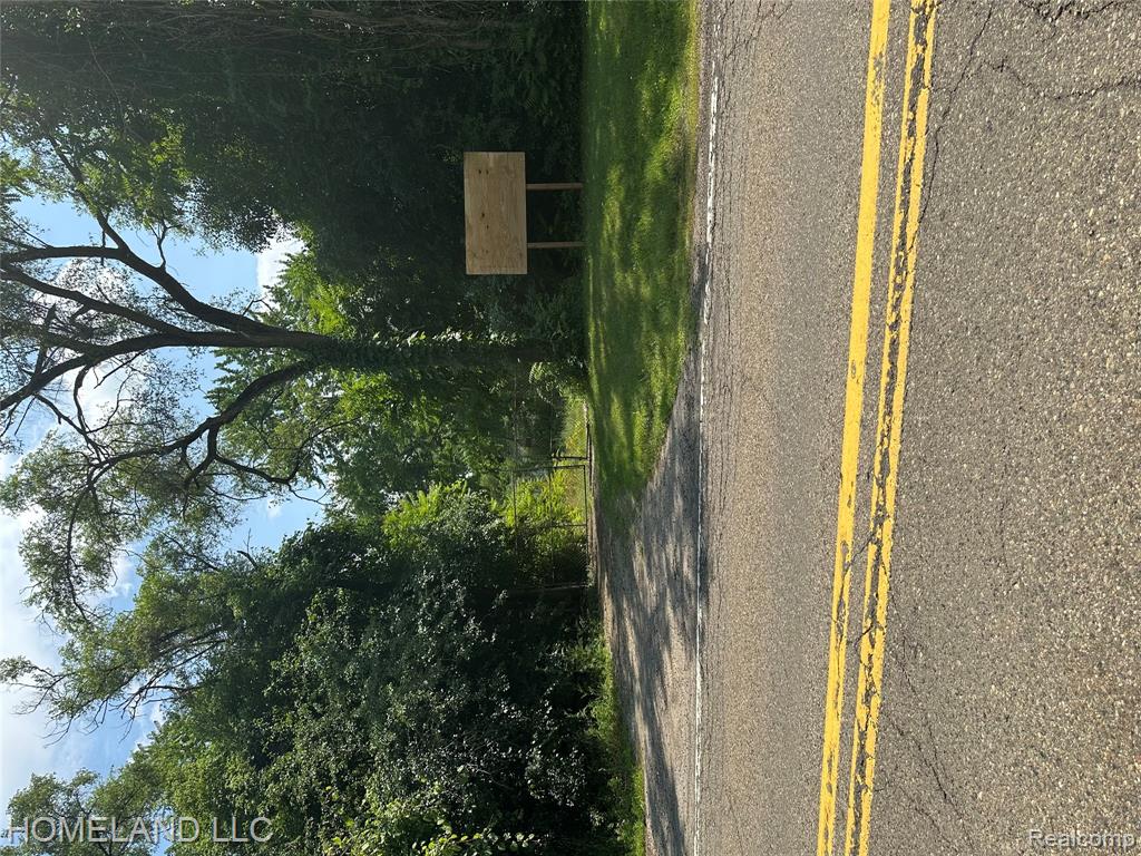 9945 Cedar Island Road, White Lake, MI — front exterior