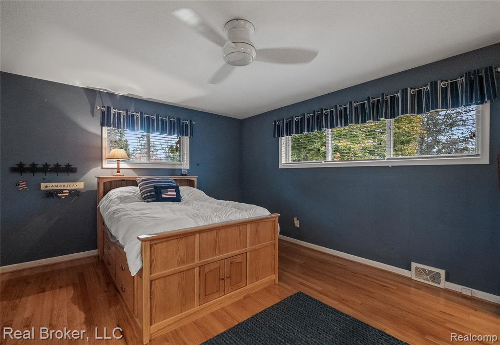 Bedroom featuring light wood-style floors and a ceiling fan