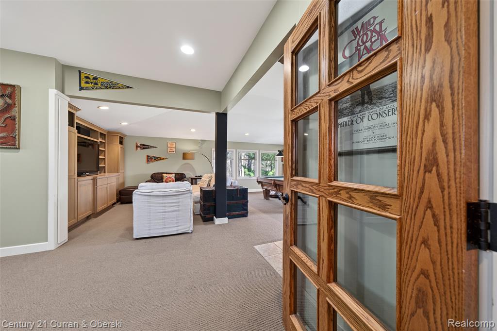 Corridor featuring light carpet and recessed lighting