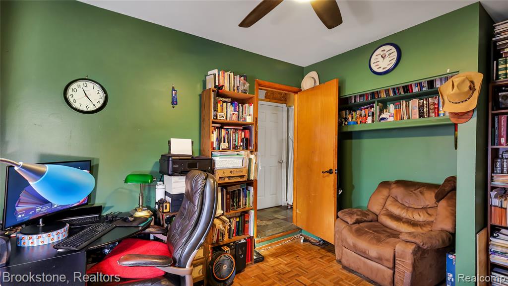 Office space featuring parquet flooring and a ceiling fan
