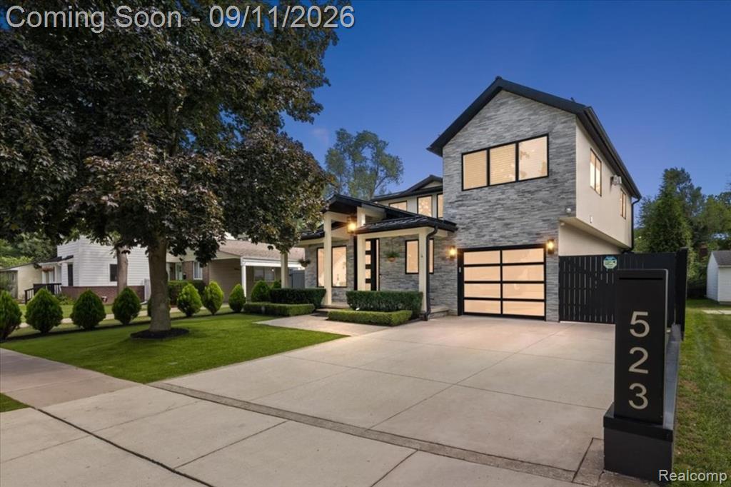 Modern facade featuring stone cladding and large windows