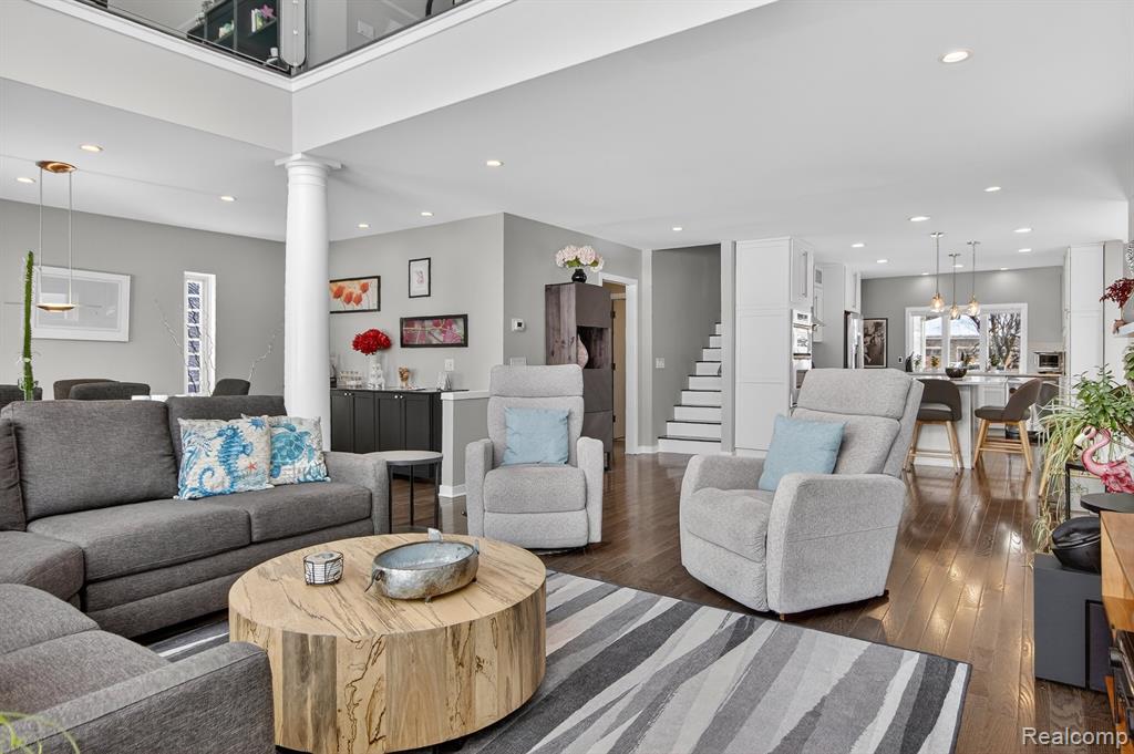 Stairs with recessed lighting and wood finished floors